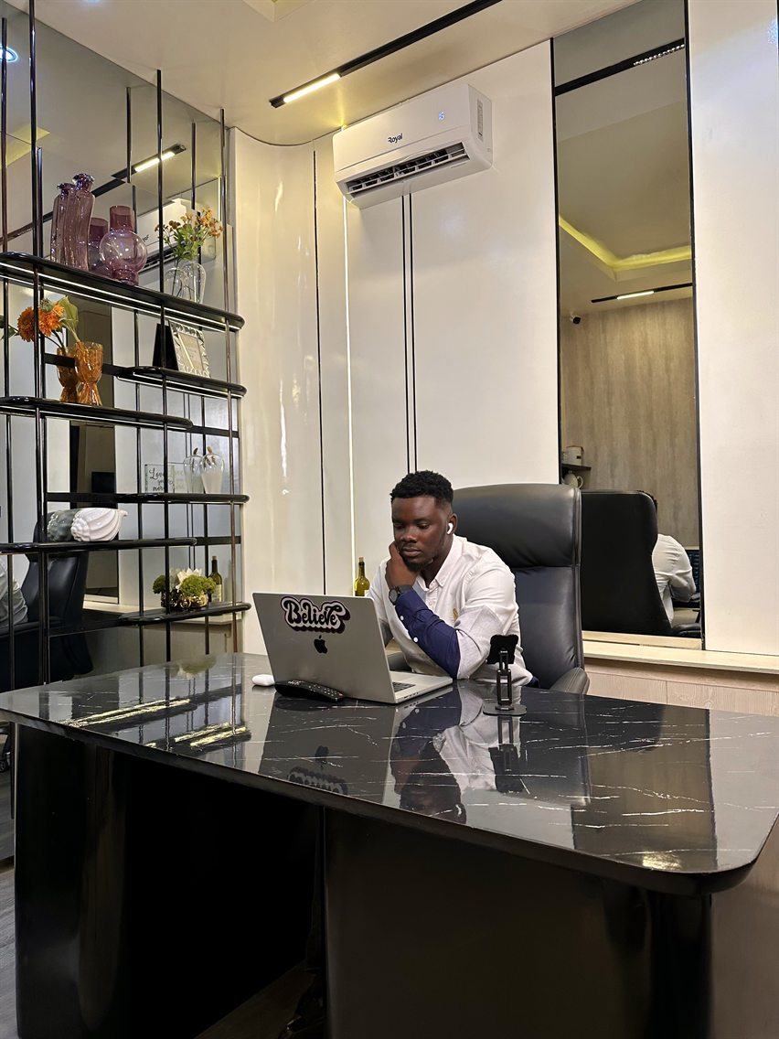 Daniel Larayetan working at his desk